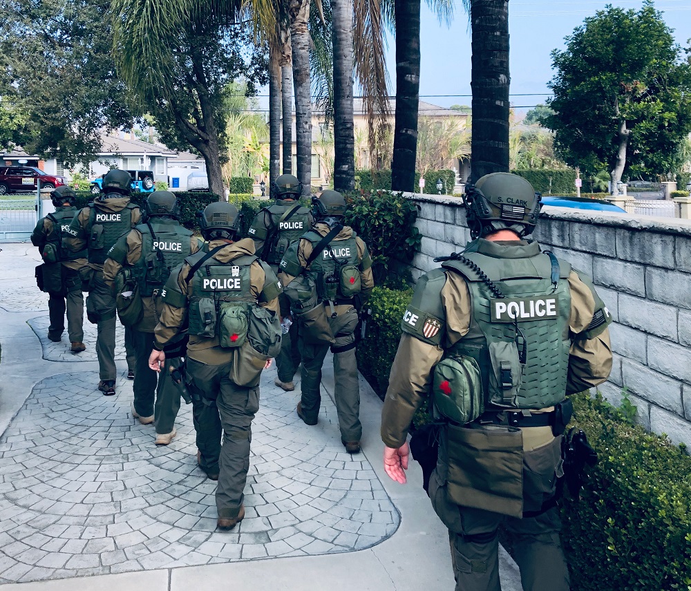 SWAT - Officers Walking down a driveway